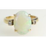 18ct Gold Ladies Ring set with a large Opal stone (approx 5ct) set with two diamonds, size K/L,