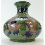 William Moorcroft vase decorated with Pomegranates on ochre ground,