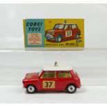 Corgi 317 Red with Pink Hood Monte Carlo Mini Cooper in excellent to near mint condition (tiny