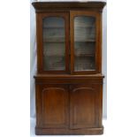 Victorian Oak two door bookcase with glazed top (some veneer missing),