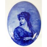 19th century Flow Blue oval wall plaque of a woman with long hair signed H Beall in the style of