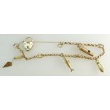 A 9ct Gold ladies CHARM BRACELET weighing 9g in total with four charms and hallmaked padlock clasp.
