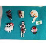 Six modern brooches with themes of cats and ladies