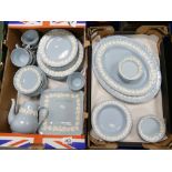 A large collection of Wedgwood Queensware dinnerware including - serving platters, dinner plates,