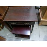 Mahogany reproduction Victorian style single drawer side table with a similar revolving book case