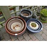 Mixed collection of stone and terracotta garden planters,