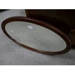 20th Century Mahogany oval bevel edged wall hanging mirror