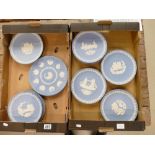 A collection of Wedgwood light blue jasperware Christmas plates from 1969 onwards (2 trays,