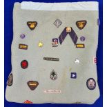 Girl Guide vintage blanket with numerous sewn GG badges and some guide related pin badges.