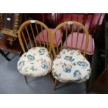 A pair of Mid-Century Ercol Windsor dining chairs