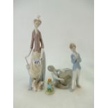 Two Lladro figures one of a lady with a dog and two boys playing instruments together with a Royal