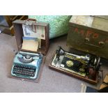 A vintage singer sewing machine in case, with unusual gilded Egyptian theme, with a A.