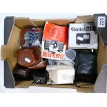 A collection of vintage 35mm items including Periflex branded camera, slide mountings,