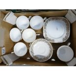 A Clarice bone china gold leaf part tea set to include 6 cups & saucers and side plates (1 tray)