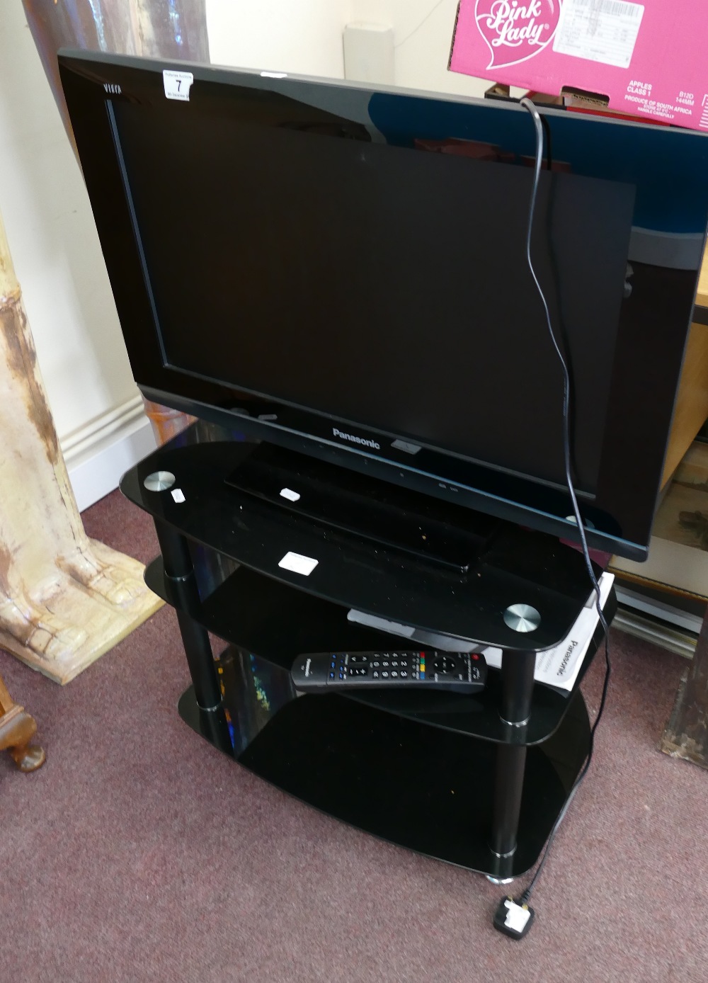 Viera Panasonic TV and a modern TV stand (with remote and power cables)