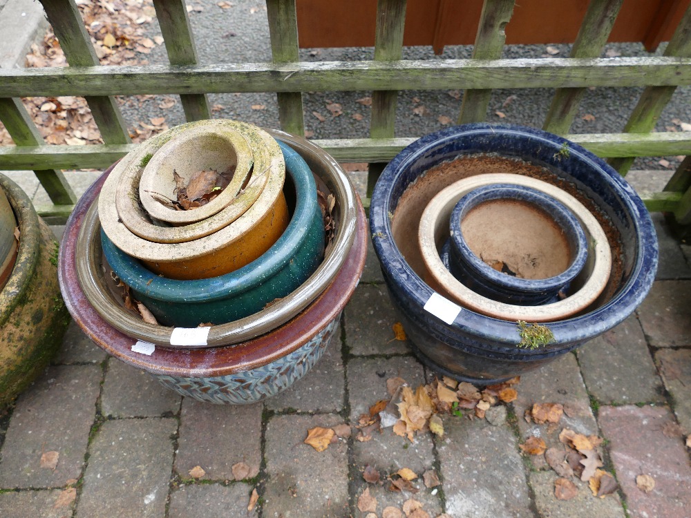 Mixed collection of stone and terracotta garden planters,