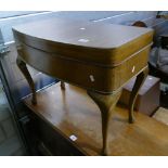 Walnut Queen Anne bow fronted low standing side table with lift up lid