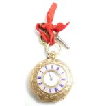 18ct gold ladies ornate half hunter fob watch with enameled front case, gross weight 38.