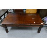 Large reproduction mahogany coffee table with brass bounding detail