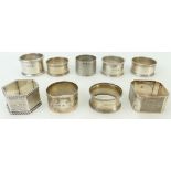 Group of nine hallmarked silver napkin rings, all with names or initials.257g.