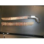 Oriental machete with carved tiger head handle and wooden sheath