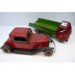 Old clockwork tin plate car and a similar flat bed lorry