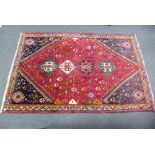 Hamadan red ground rug with geometric decoration with 4 central medallions 262x172