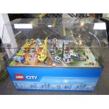Lego City shop display unit containing construction site boats and swamp scenes, Movable and