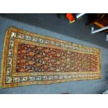 Antique Persian geometric runner having repeated decoration 258cm x 87cm