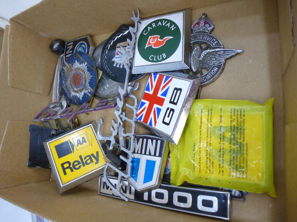 Collection of vintage car badges incl, Mini etc with owners handbook for Vauxhall