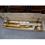 A vintage croquet set having 4 mallets in pine box