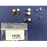 Pair of cultured pearl ear studs with 9ct yellow gold backs, a smaller pair of cultured pearl ear