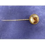 19th century rock crystal and a yellow coloured metal tie pin with reverse intaglio of a horse head