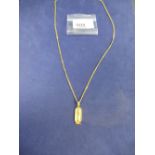 Egyptian yellow coloured metal pendant, stamped foreign mark, 3.5cm long on an 18ct yellow gold