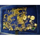 Collection of yellow coloured metal earrings, loose links neckchain etc. in a blue leather box