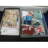 A Tray of playing cards and a box of mixed loose stamps