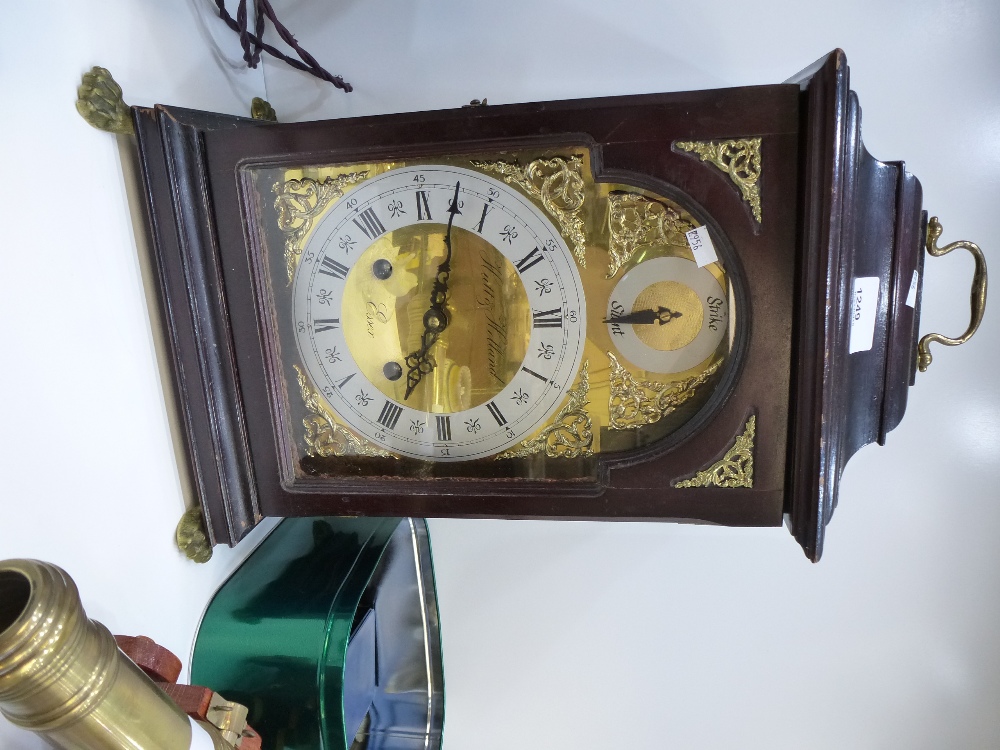 20 Century bracket clock by Hutt and Holland Essex on brass paw feet