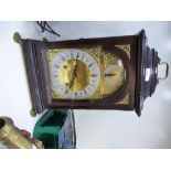 20 Century bracket clock by Hutt and Holland Essex on brass paw feet