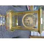 A French Onyx and gilt 4 glass mantle clock with bow sides and compensated pendulum 31cm