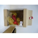 A small modern Steiff teddy in a box