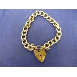 Rolled gold curb link bracelet, unmarked, with rolled gold heart shaped clasp gross weight