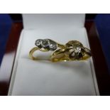 22ct yellow gold ring set with a small diamond, stamped 22ct and an 18ct yellow gold 3 stone diamond