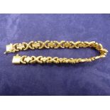 9ct yellow gold bracelet with stylised flat links, stamped 375 approx 12g