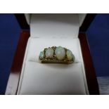 18ct Yellow gold ring set with 5 opals and diamond chips, shank stamped 18 size O