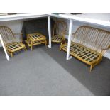 An Ercol Stick back settee, with matching armchairs and stools, no cushions