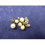 Pair of cultured pearl ear studs with 9ct yellow gold backs, smaller pair of cultured pearl ear