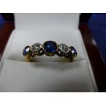 18ct Yellow gold ring set with 2 diamonds and 3 sapphires, shank stamped 18ct, size Q/R