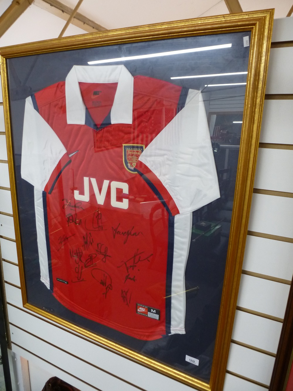 A 1990s Arsenal signed football shirt, framed