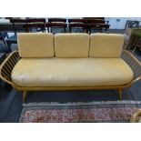 A similar Ercol settee having open arms, 206 cms