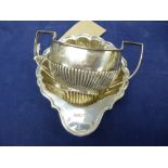 Edwardian silver shell shaped butter dish, Sheffield 1907, on a ball feet and a small sugar basin